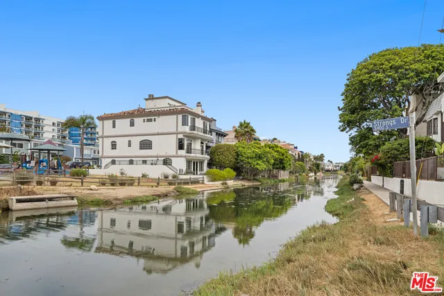 a view of a lake with building in front of it