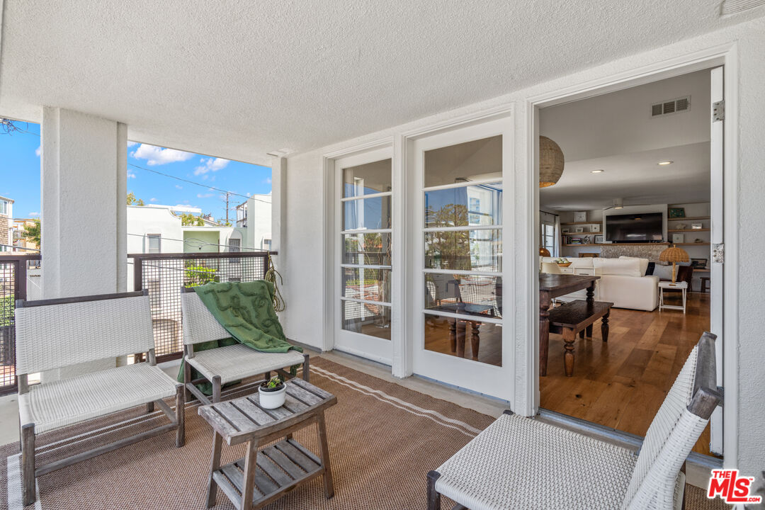 3503 Esplanade Marina del Rey, CA 90292 - Photo 9 of 25 a living room with furniture and a floor to ceiling window