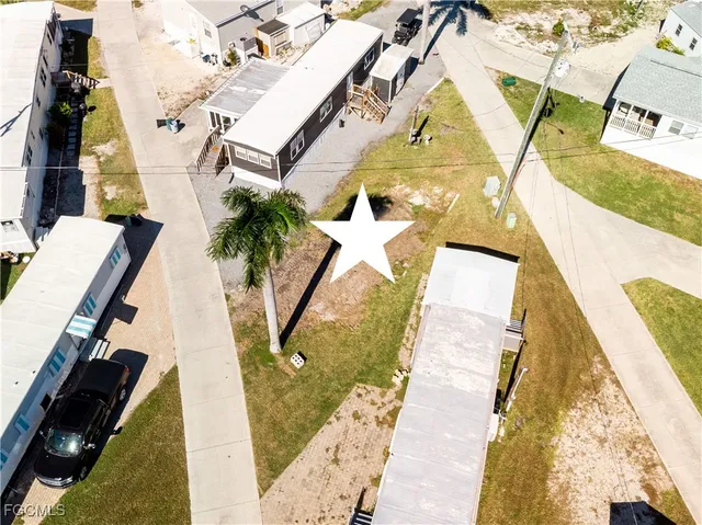 an aerial view of a residential houses with outdoor space