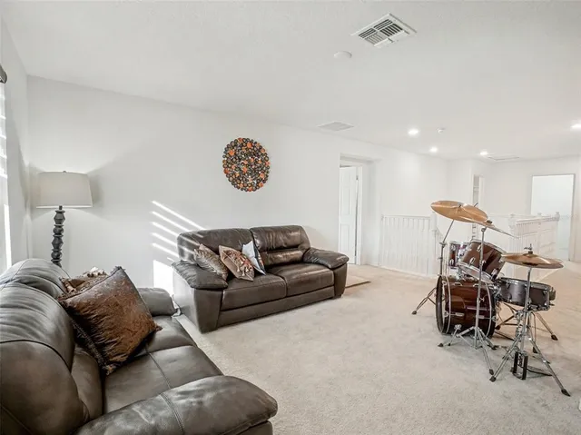 a bathroom with a granite countertop sink a mirror and a bathtub