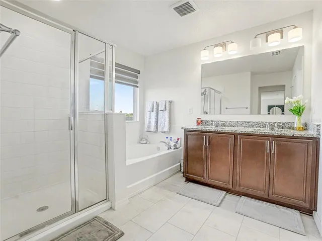 a view of a house with a small yard and plants