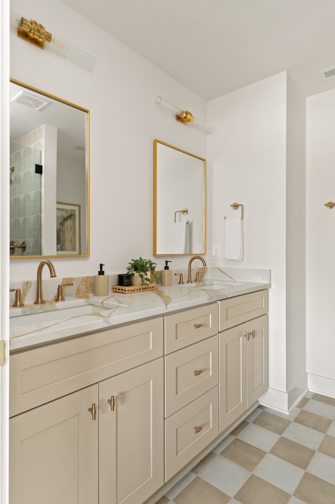504 Edwin Street Nashville, TN 37207 - Photo 27 of 49 a bathroom with double sink and a mirror