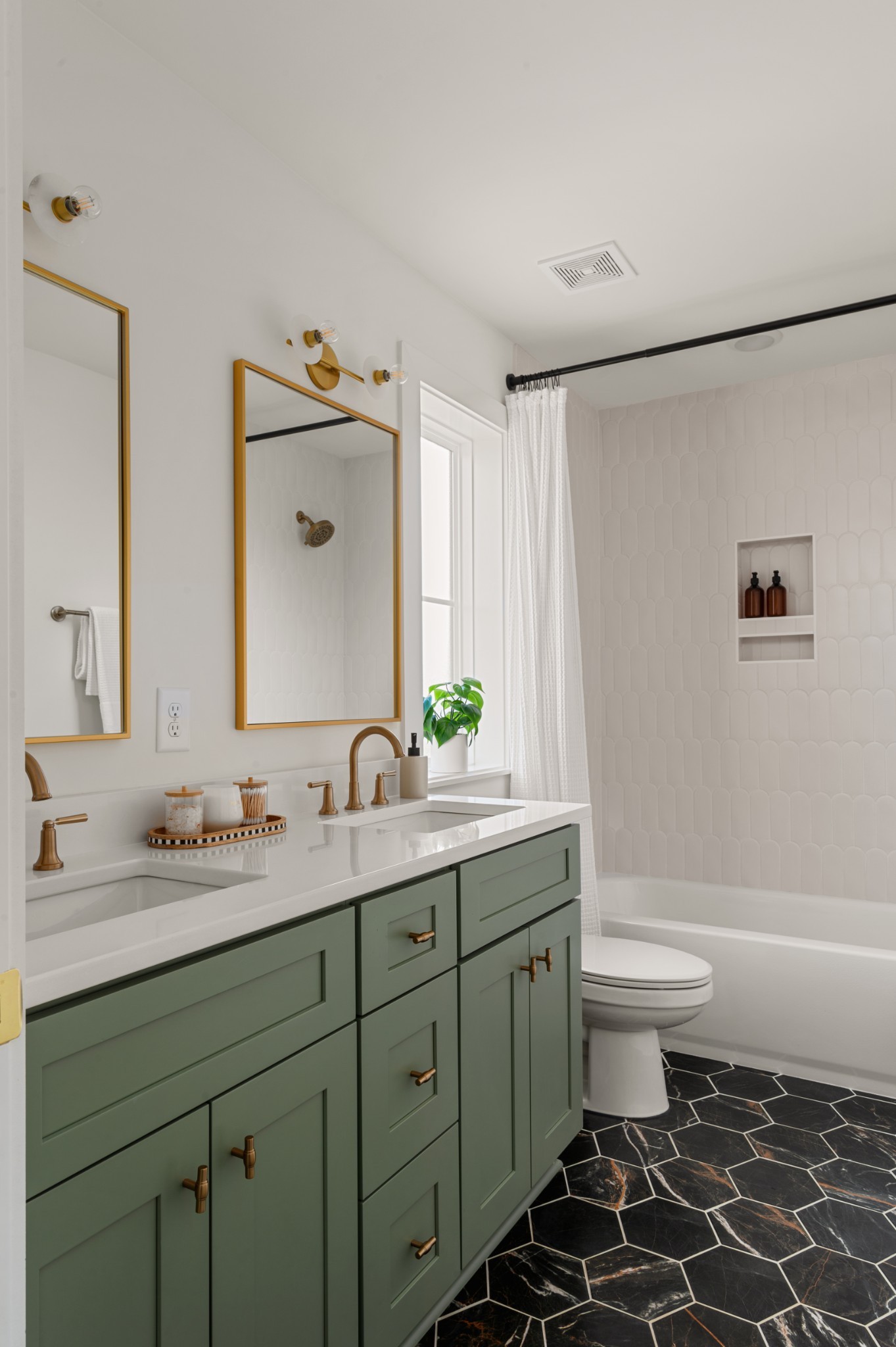 504 Edwin Street Nashville, TN 37207 - Photo 32 of 49 a bathroom with a double vanity sink toilet mirror and bathtub