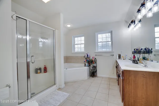 a bath room with a bath tub and a shower