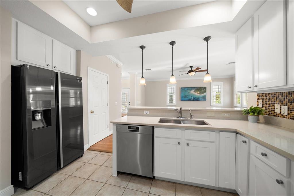 270 2nd Avenue Southwest Largo, FL 33770 - Photo 17 of 67 a kitchen with a sink stainless steel appliances and cabinets