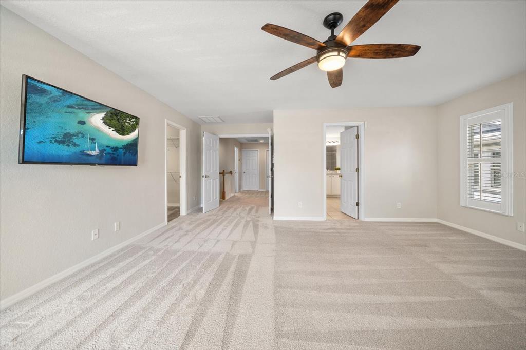 270 2nd Avenue Southwest Largo, FL 33770 - Photo 27 of 67 a view of an empty room with a window and a ceiling fan