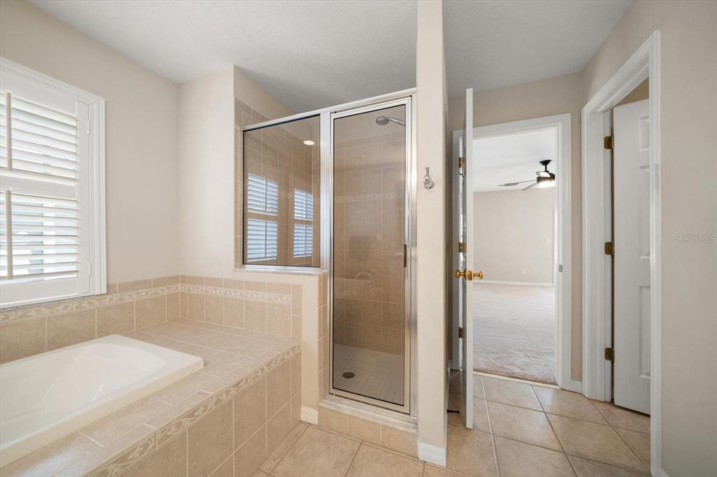 270 2nd Avenue Southwest Largo, FL 33770 - Photo 38 of 67 a bathroom with a bathtub and shower