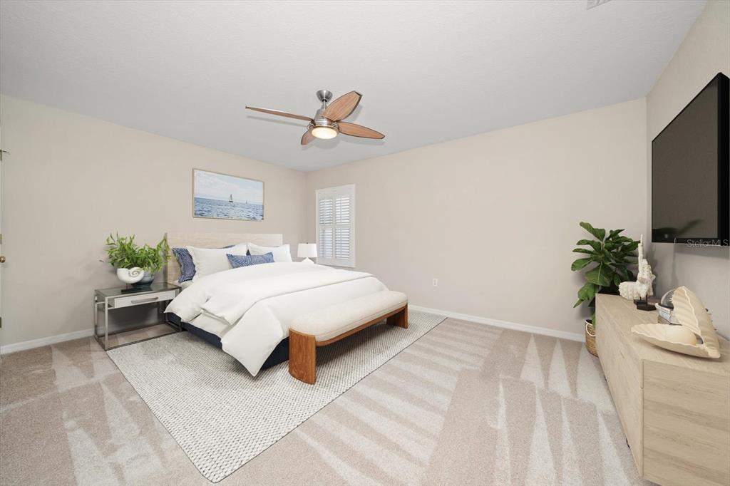 270 2nd Avenue Southwest Largo, FL 33770 - Photo 40 of 67 a bedroom with a bed and a flat screen tv