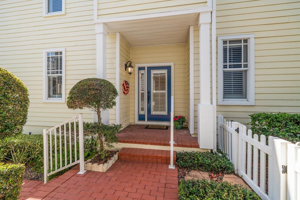 270 2nd Avenue Southwest Largo, FL 33770 - Photo 5 of 67 a view of a house with brick walls and potted plants