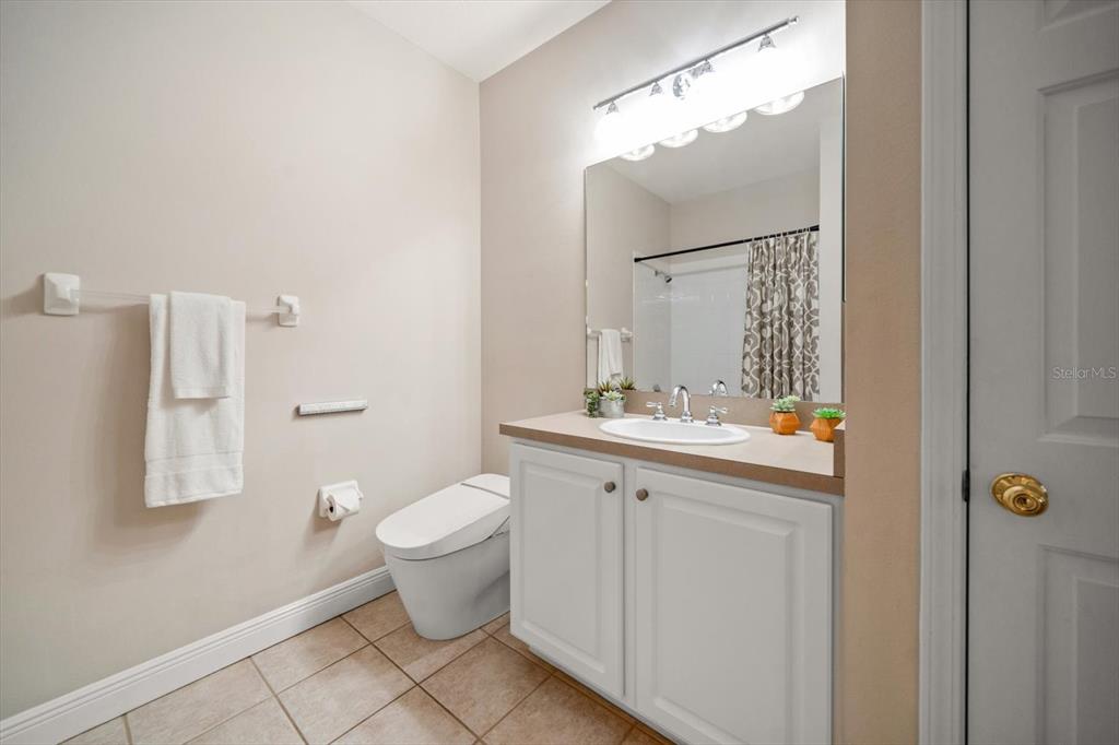 270 2nd Avenue Southwest Largo, FL 33770 - Photo 51 of 67 a bathroom with a toilet sink and mirror