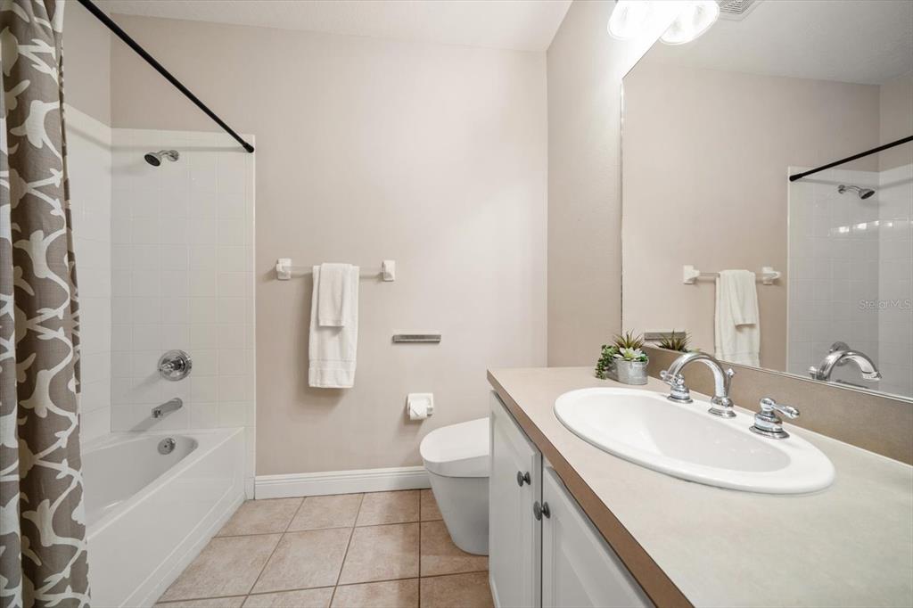 270 2nd Avenue Southwest Largo, FL 33770 - Photo 52 of 67 a bathroom with a sink a toilet and shower