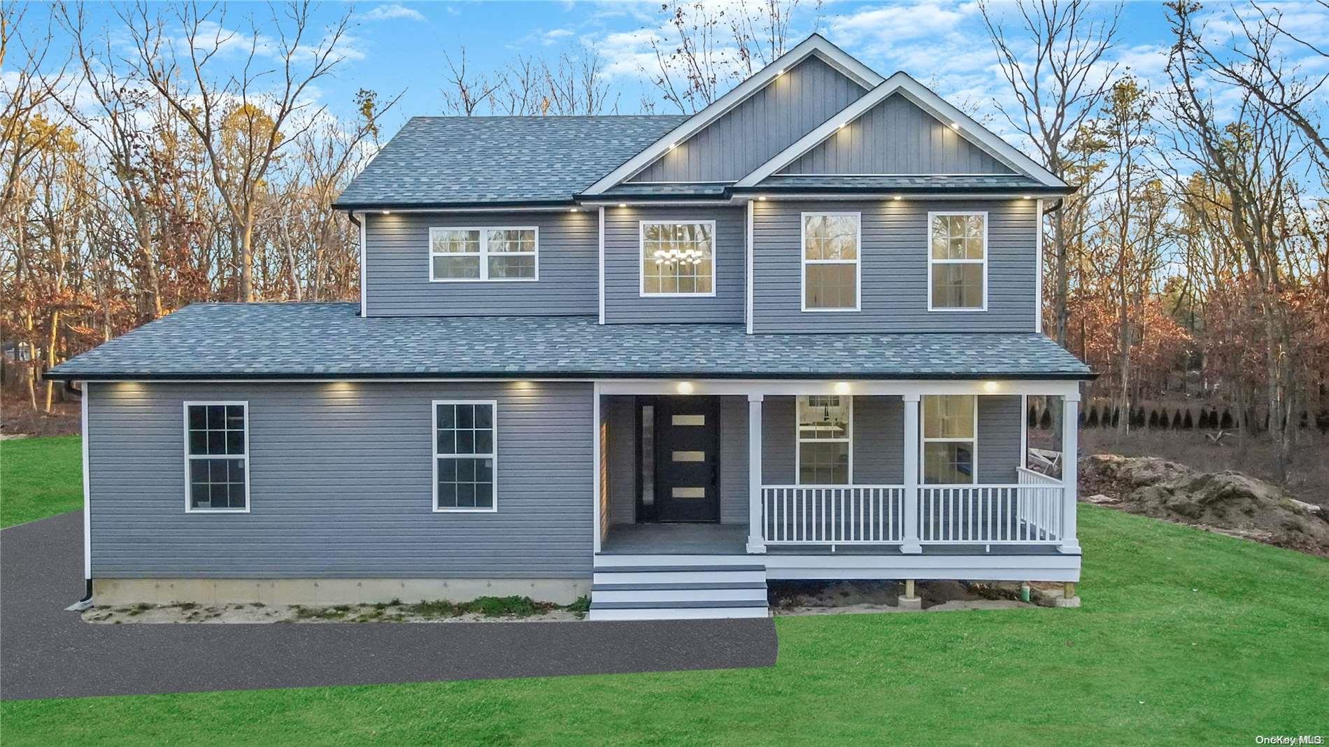 636 Middle Country Road Ridge, NY 11961 - Photo 1 of 1 a front view of a house with a yard