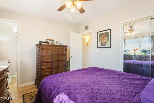 a bedroom with a bed and a dresser