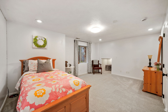 357 South 320 W Street Lindon, UT 84042 - Photo 26 of 41 Spacious room featuring light-colored carpeting, recessed lighting, and a window with blinds