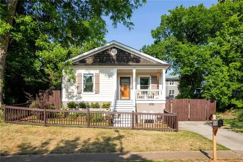 a front view of a house with a fence
