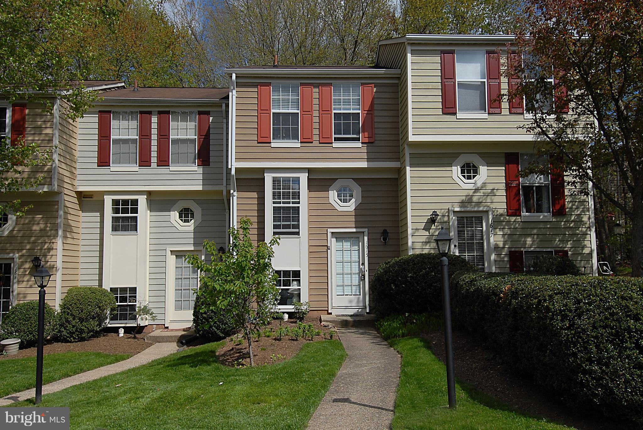 1615 Fieldthorn Drive Reston, VA 20194 - Photo 1 of 28 a front view of a house with garden