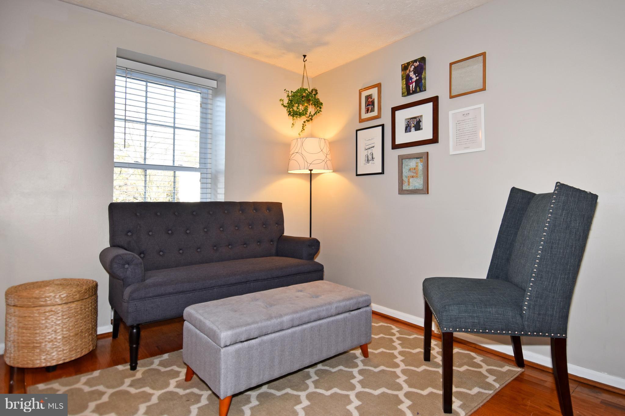 1615 Fieldthorn Drive Reston, VA 20194 - Photo 3 of 28 a living room with furniture and a window