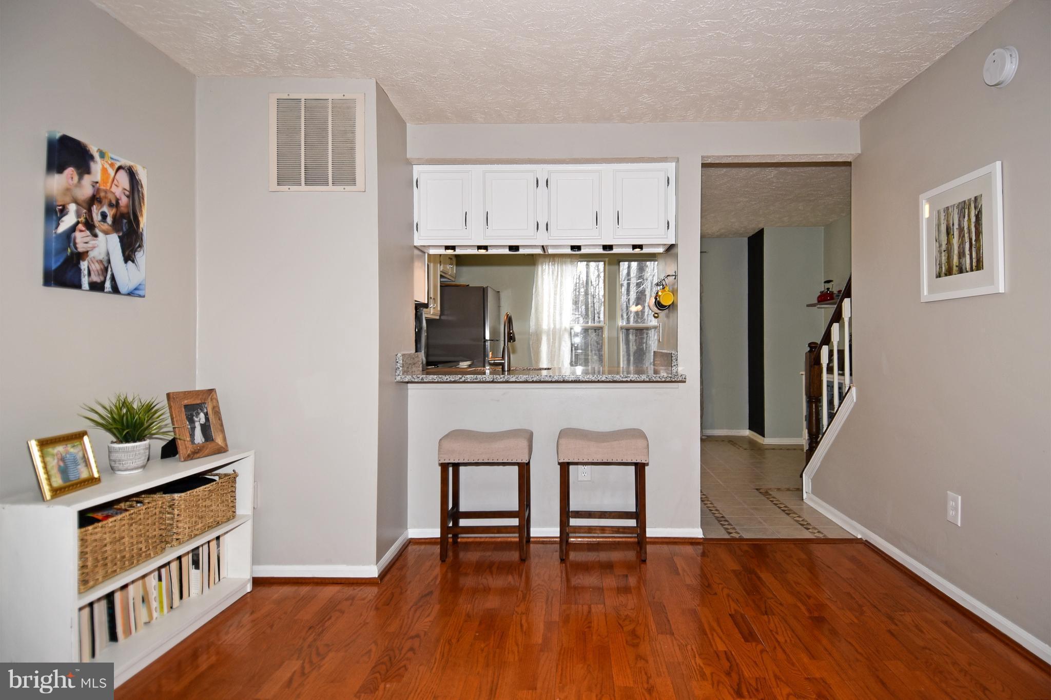 1615 Fieldthorn Drive Reston, VA 20194 - Photo 4 of 28 a living room with furniture and a table
