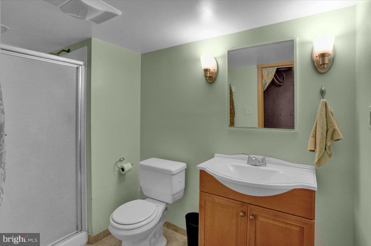 136 West Elm Street Reading, PA 19607 - Photo 20 of 23 a bathroom with a sink a toilet and mirror
