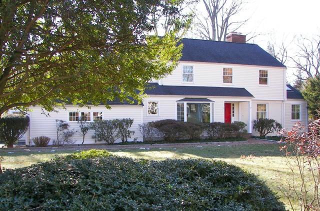 18 Welwyn Road Greenwich, CT 06878 - Photo 1 of 1 a front view of a house with a yard