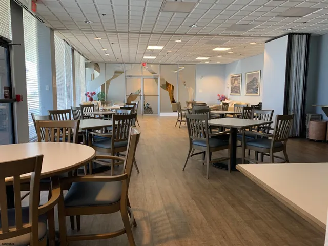 a view of a dining area with furniture and wooden floor