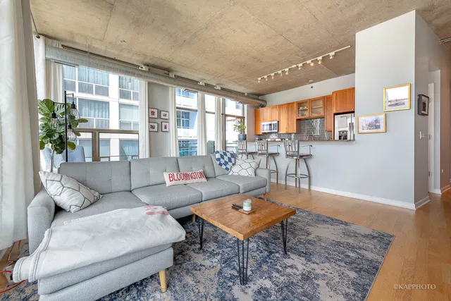 a living room with furniture and a table