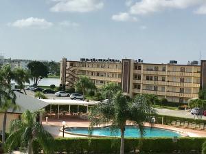 1010 Wolverton East Boca Raton, FL 33434 - Photo 15 of 30 a view of large building with a yard