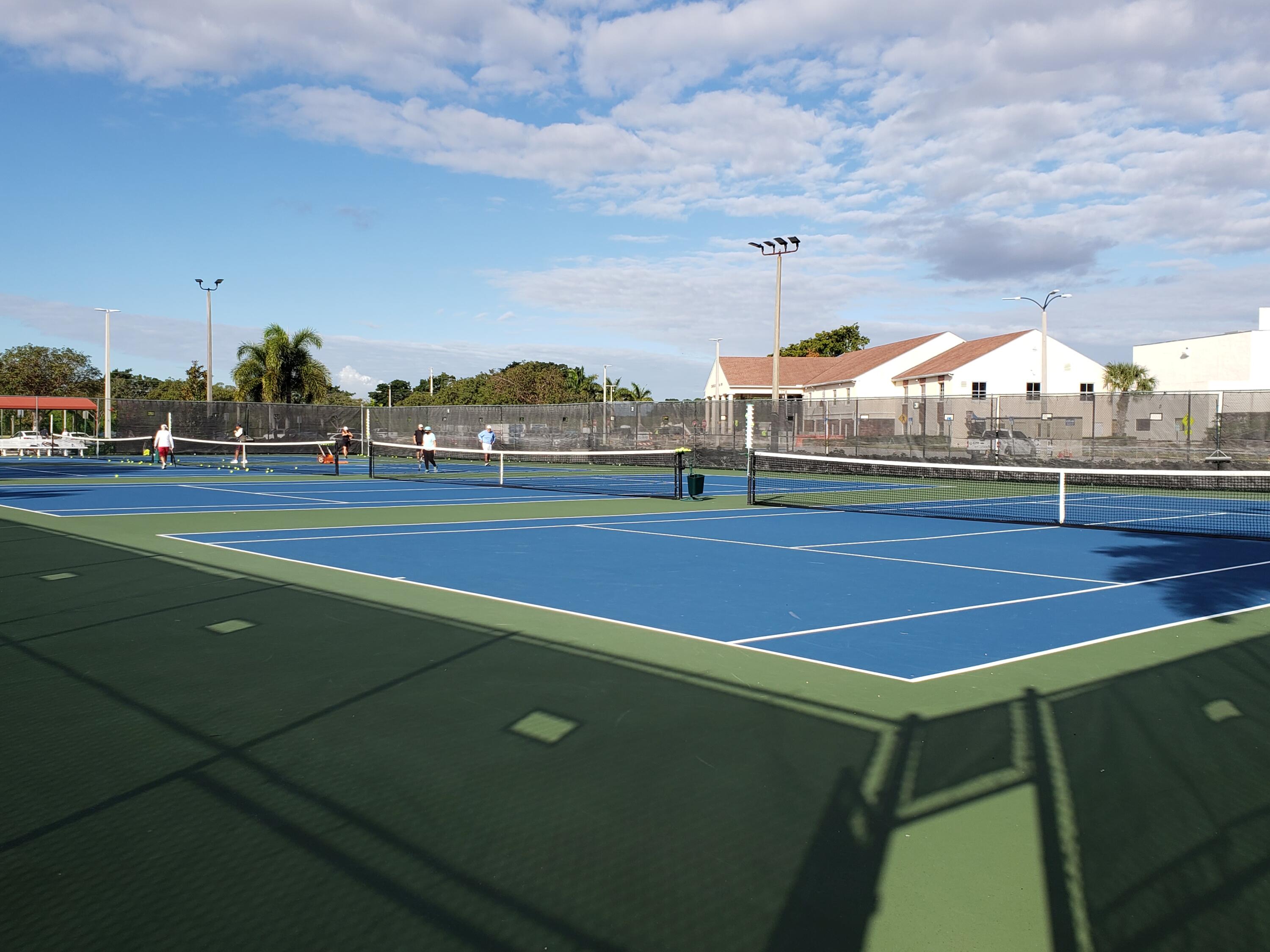 1010 Wolverton East Boca Raton, FL 33434 - Photo 20 of 30 a view of an outdoor space and tennis court