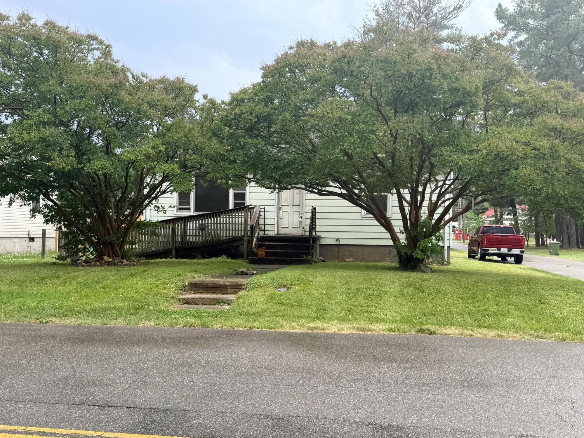 300 East Riverside Drive Salem, VA 24153 - Photo 11 of 11 a front view of a house with a yard and garage