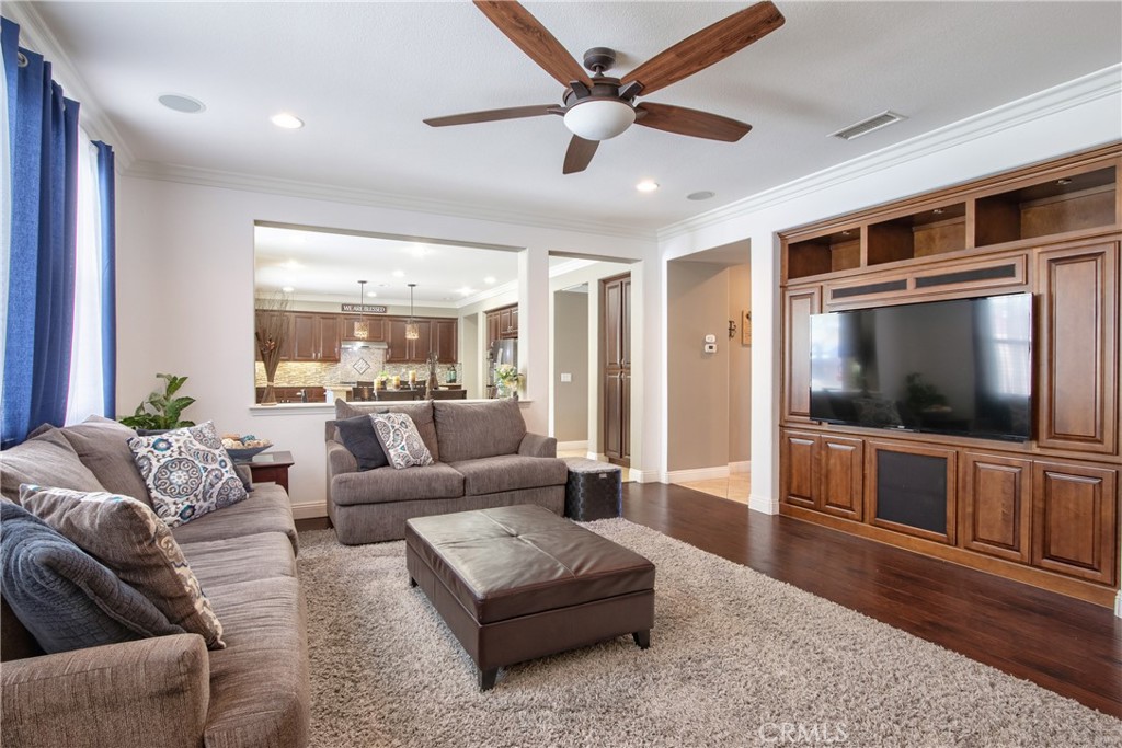 28483 Nautical Point Circle Menifee, CA 92585 - Photo 10 of 44 a living room with furniture and a flat screen tv