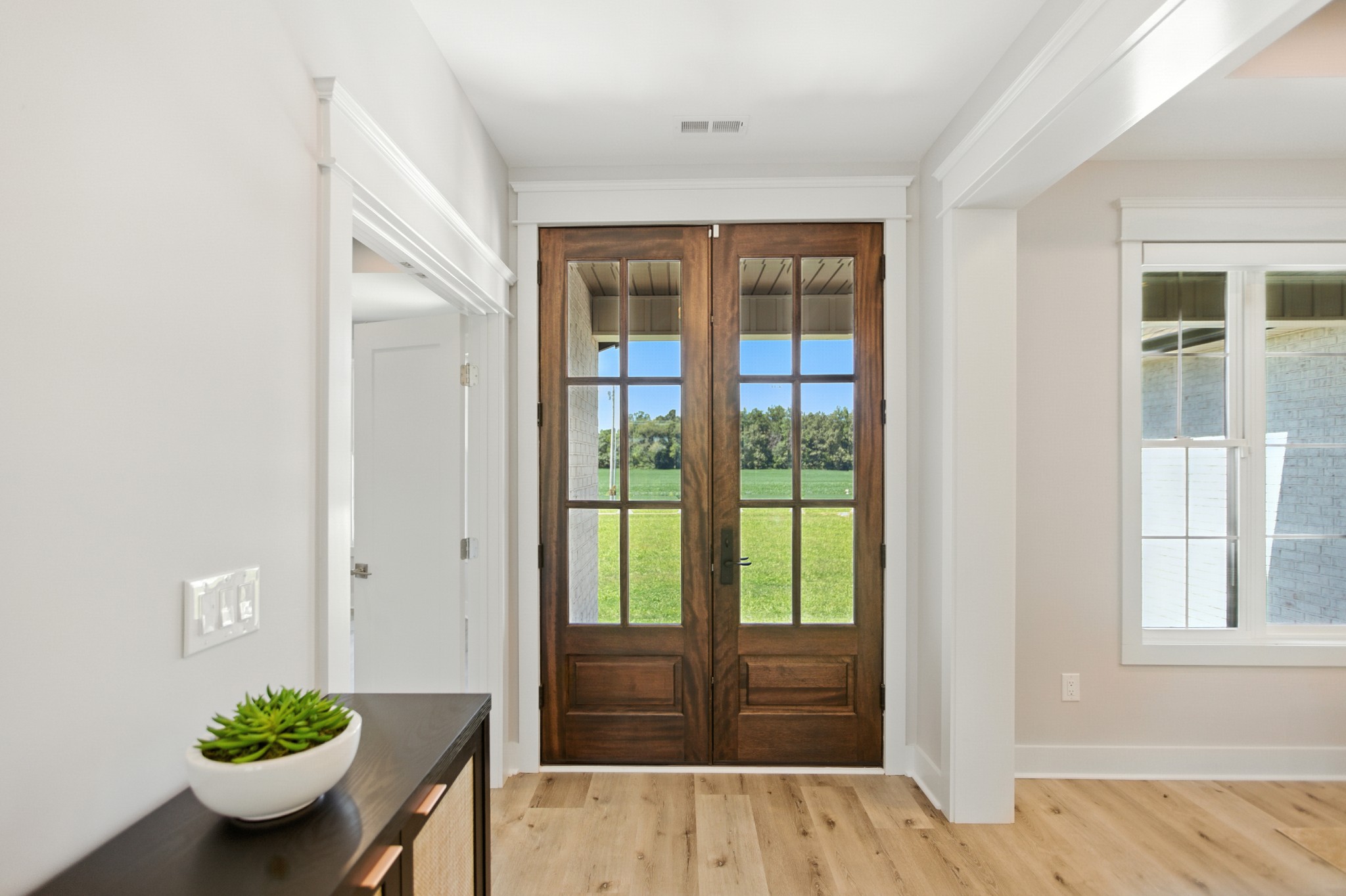 74 Holt Lane Tullahoma, TN 37388 - Photo 5 of 72 a room with wooden floor and potted plant
