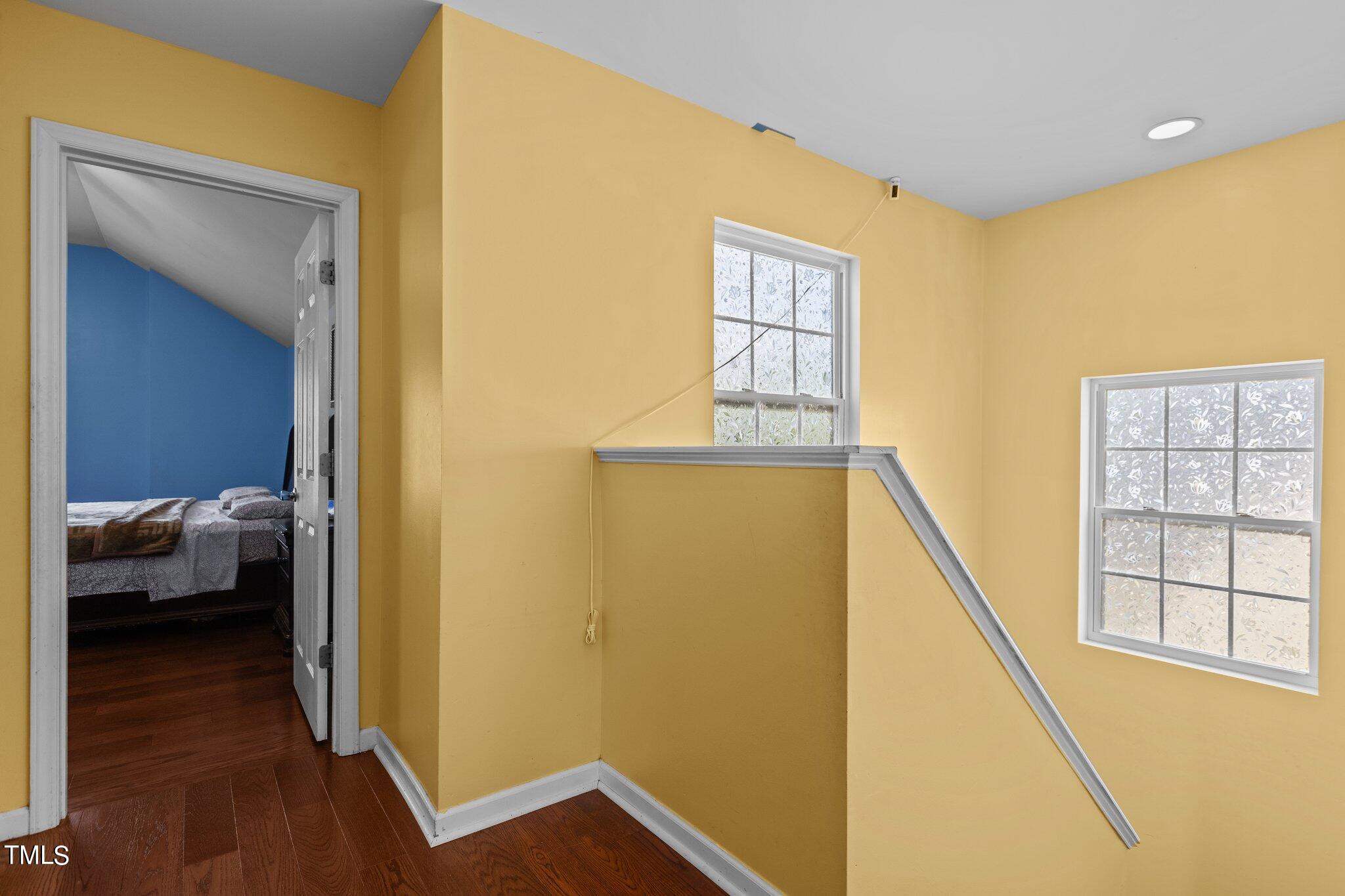 4232 Dalcross Road Raleigh, NC 27610 - Photo 18 of 38 a view of a hallway with wooden floor and closet