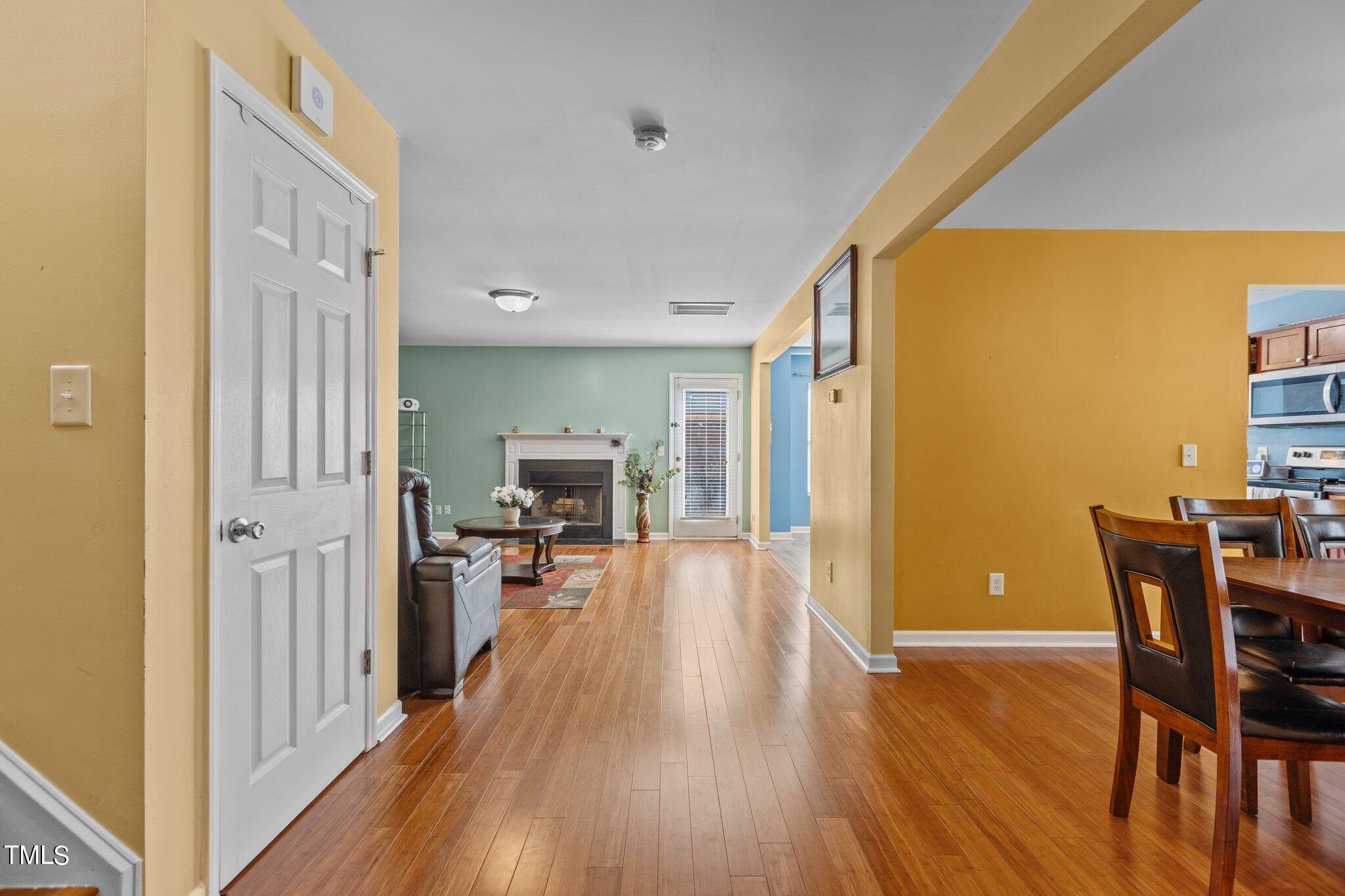 4232 Dalcross Road Raleigh, NC 27610 - Photo 2 of 38 a view of a dining area with furniture wooden floor and a window