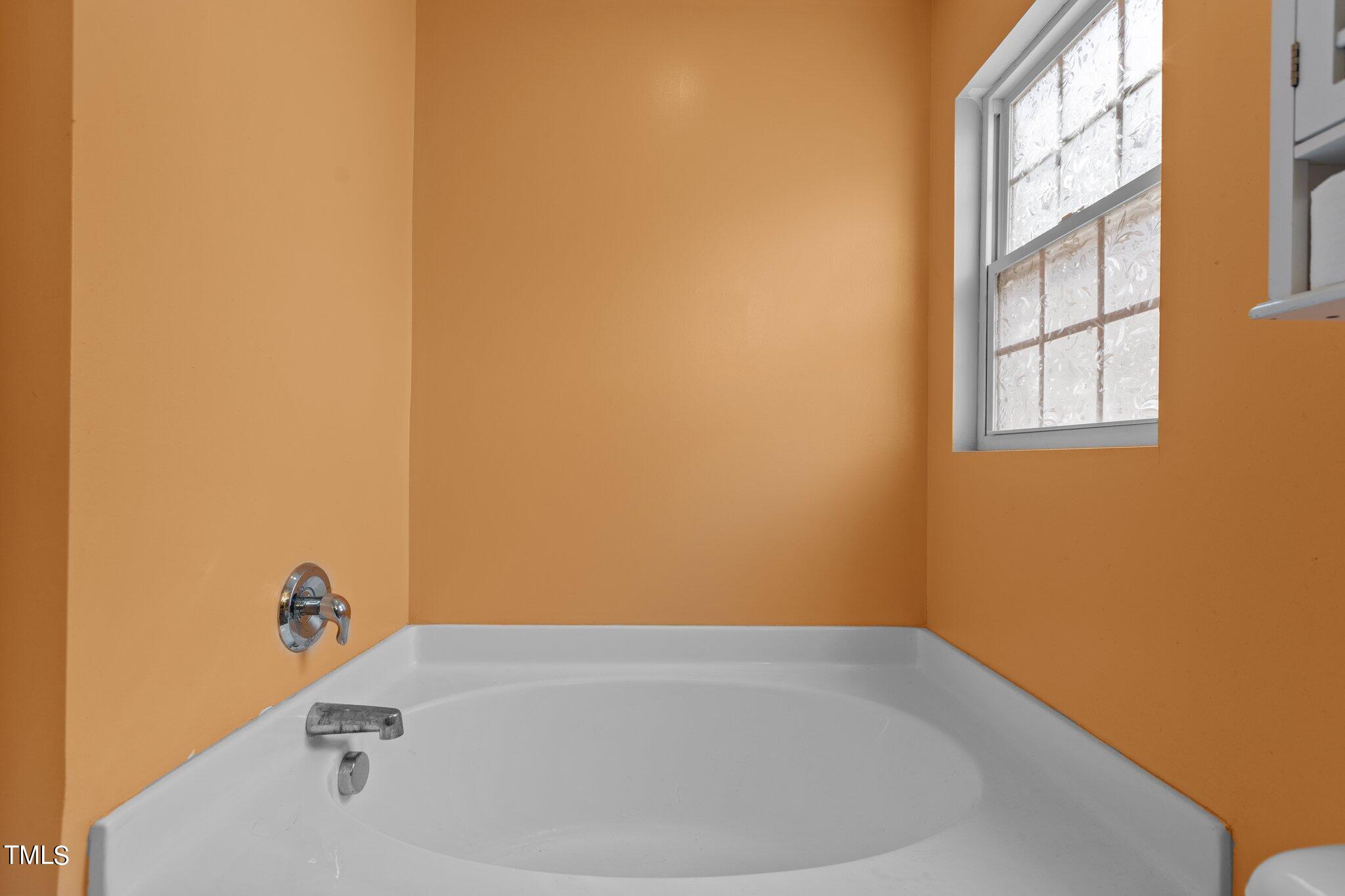 4232 Dalcross Road Raleigh, NC 27610 - Photo 23 of 38 a bathroom with a bathtub