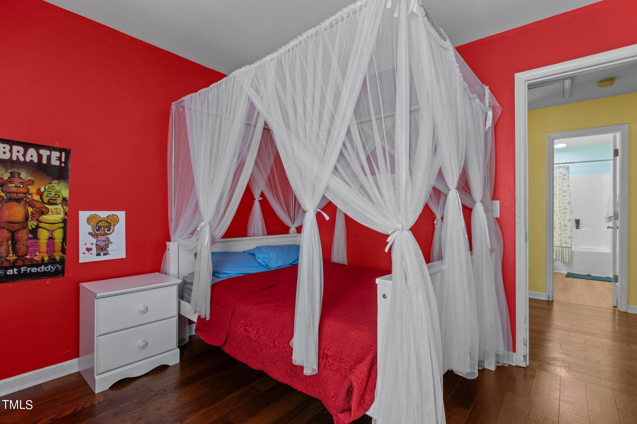 4232 Dalcross Road Raleigh, NC 27610 - Photo 25 of 38 a bed room with a bed and a couch