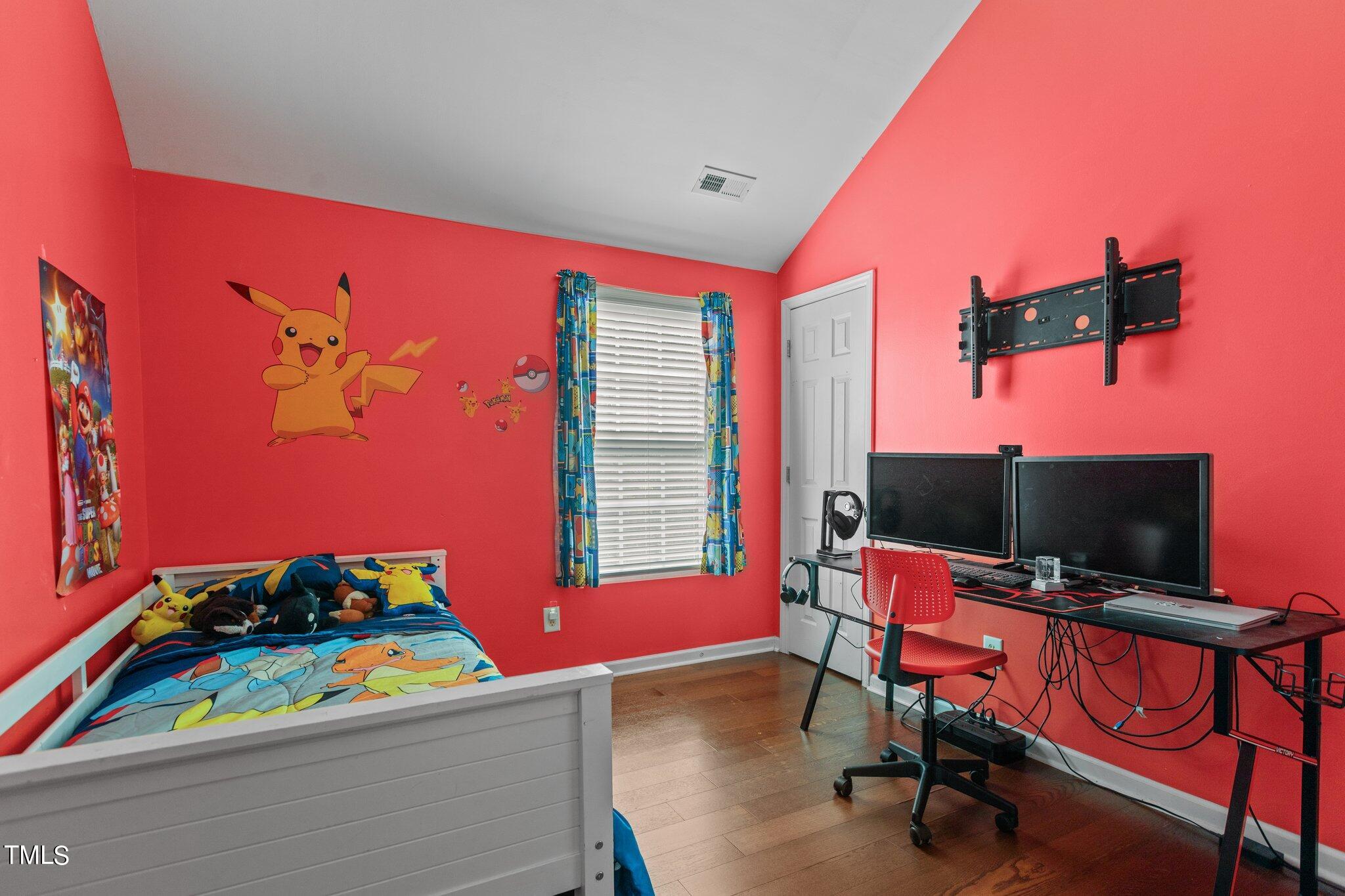 4232 Dalcross Road Raleigh, NC 27610 - Photo 26 of 38 a room with furniture and a flat screen tv