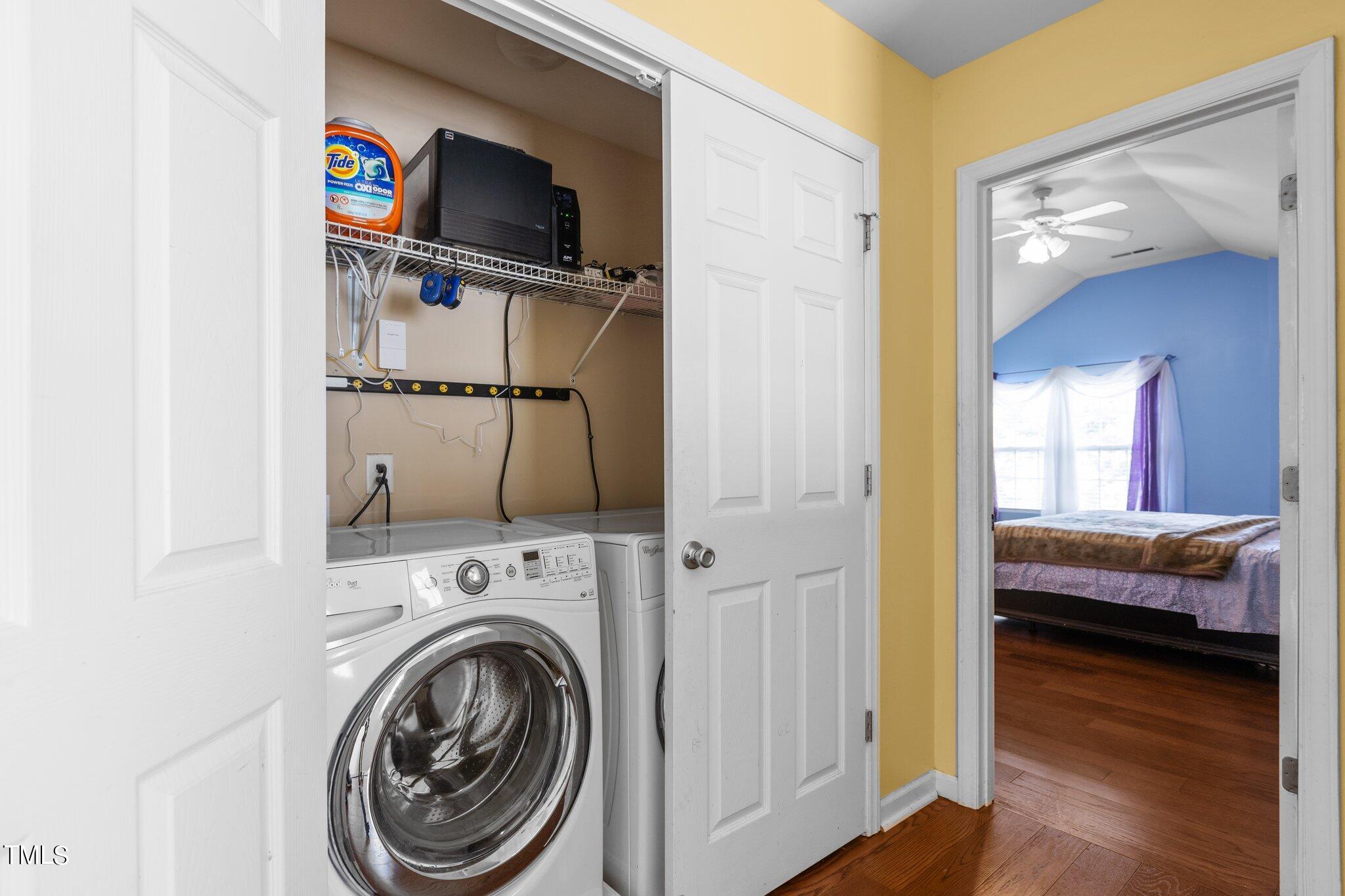 4232 Dalcross Road Raleigh, NC 27610 - Photo 31 of 38 a view of a bedroom with washer and dryer
