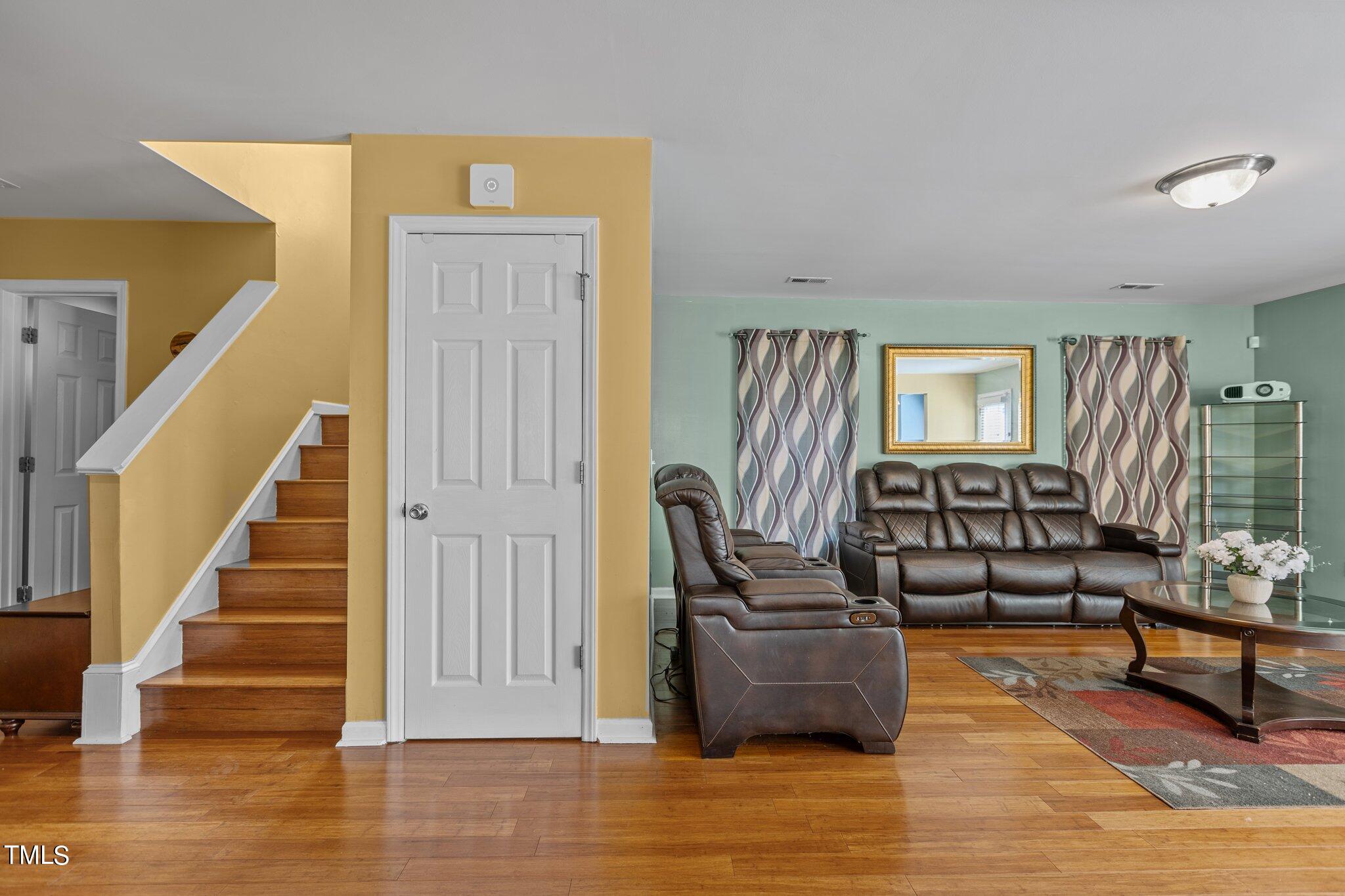 4232 Dalcross Road Raleigh, NC 27610 - Photo 6 of 38 a living room with furniture and wooden floor