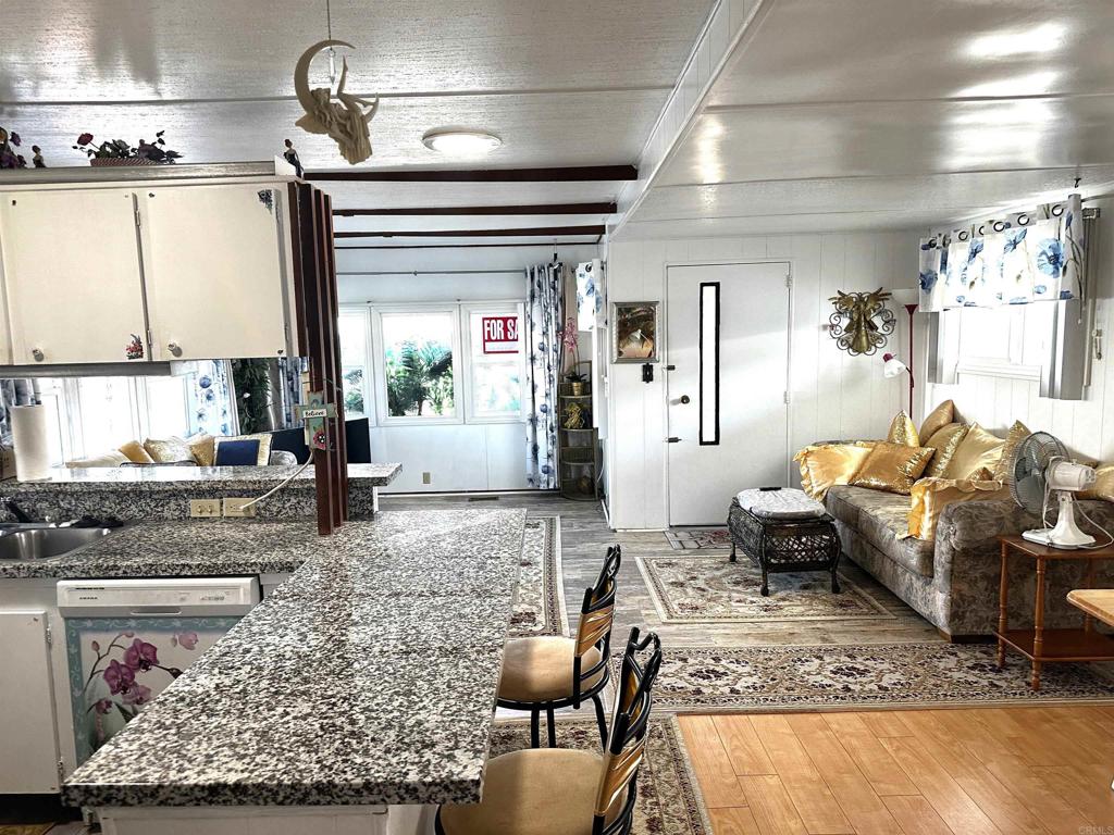 143 Swallow Lane Oceanside, CA 92057 - Photo 4 of 11 a living room with furniture and a rug