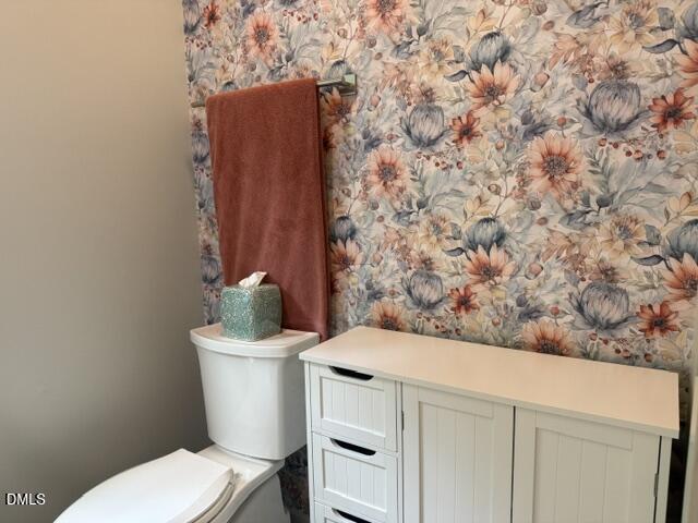 574 East Ridge Avenue Liberty, NC 27298 - Photo 22 of 28 a bathroom with a toilet and a sink