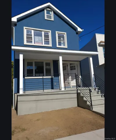 a front view of a house with a garage