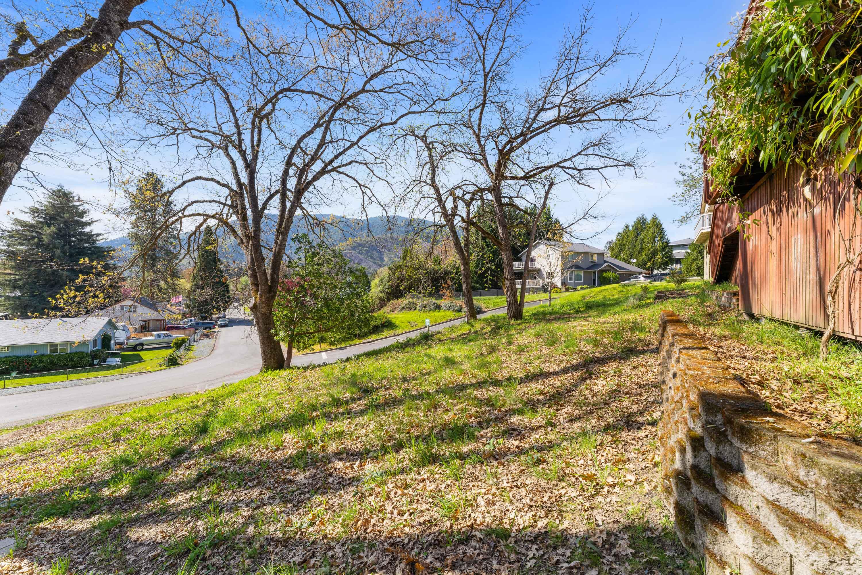 105 Cedar Ridge Terrace Rogue River, OR 97537 - Photo 23 of 23 a view of yard with swimming pool and green space