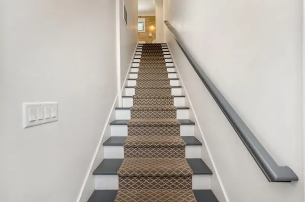 a view of room with window and wooden floor