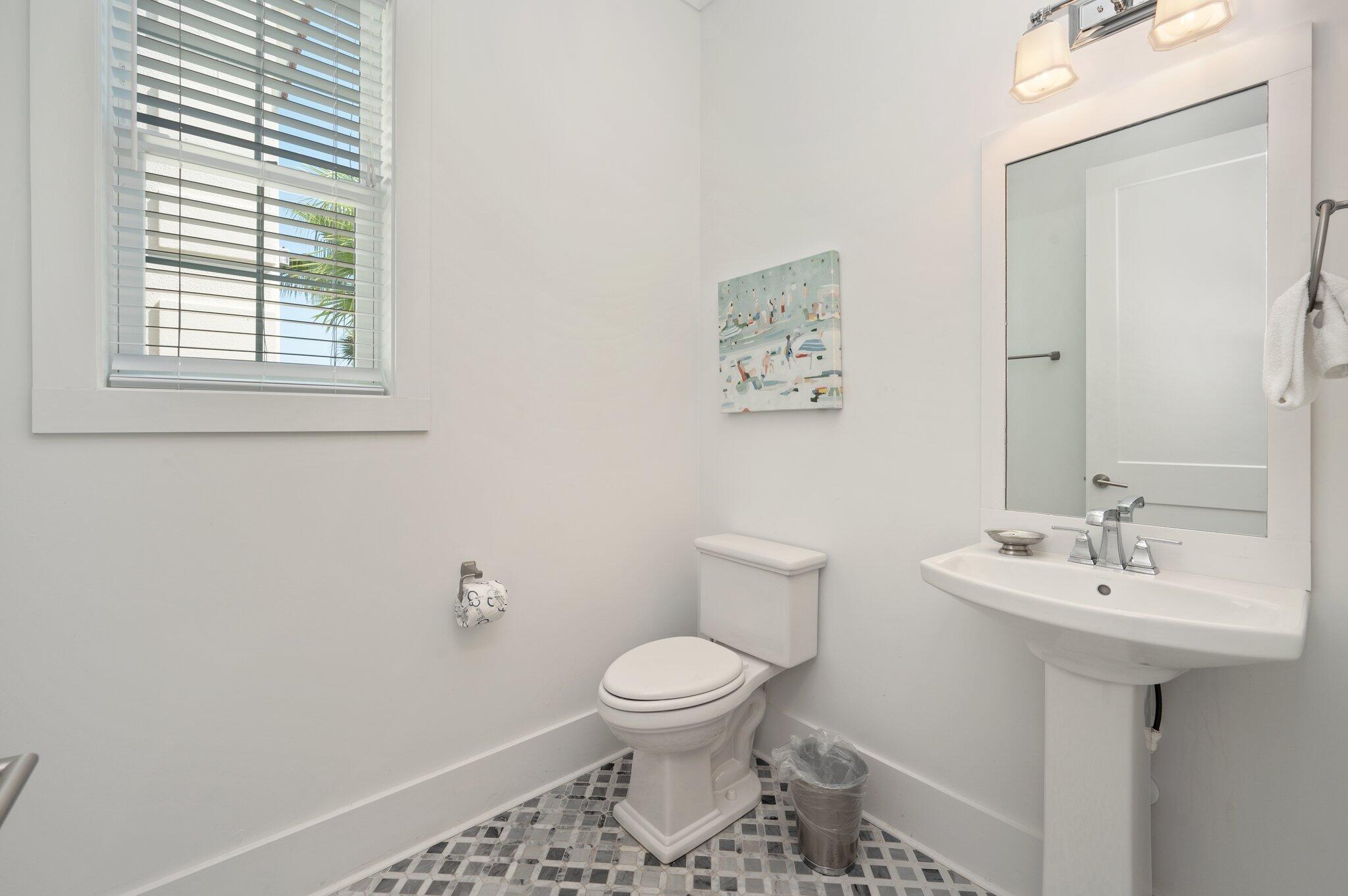 4795 Ocean Boulevard Destin, FL 32541 - Photo 24 of 50 a bathroom with a toilet sink and mirror