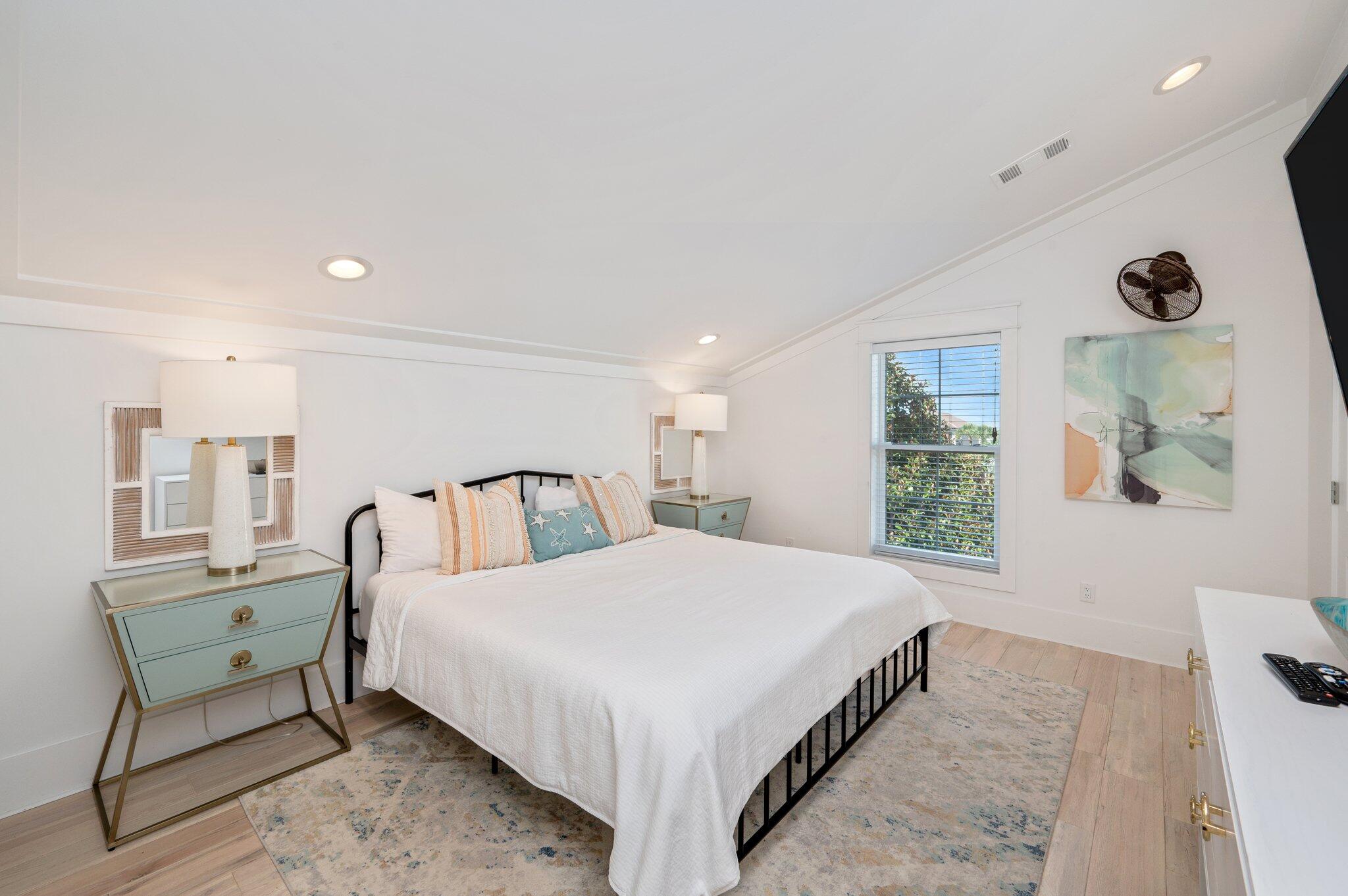 4795 Ocean Boulevard Destin, FL 32541 - Photo 26 of 50 a large bedroom with a bed and a window