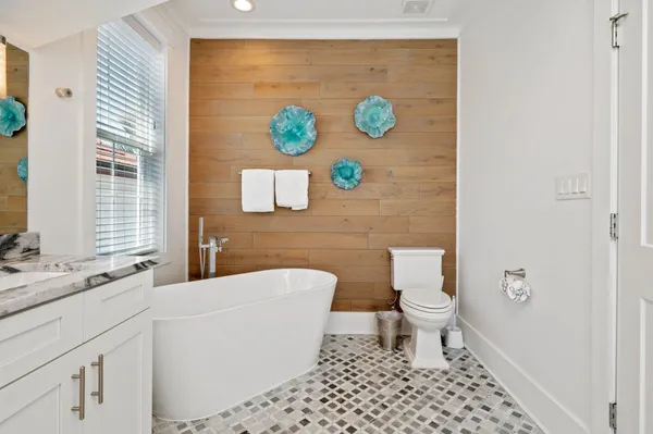 a white bath tub sitting in a bathroom