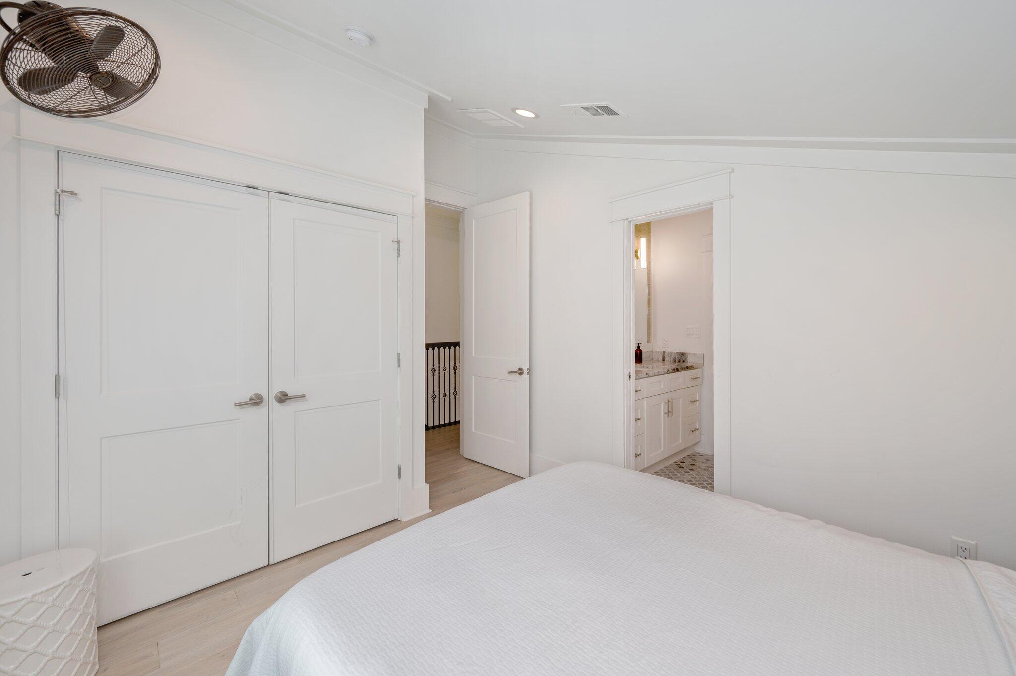 4795 Ocean Boulevard Destin, FL 32541 - Photo 39 of 50 a bedroom with a bed and cabinets