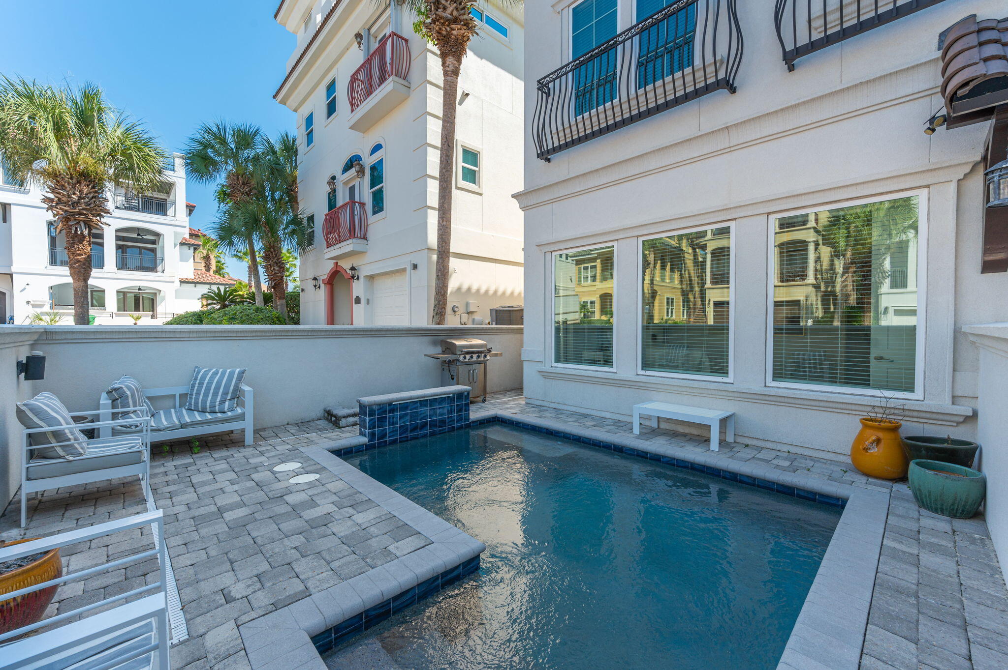 4795 Ocean Boulevard Destin, FL 32541 - Photo 49 of 50 a swimming pool with outdoor seating and yard