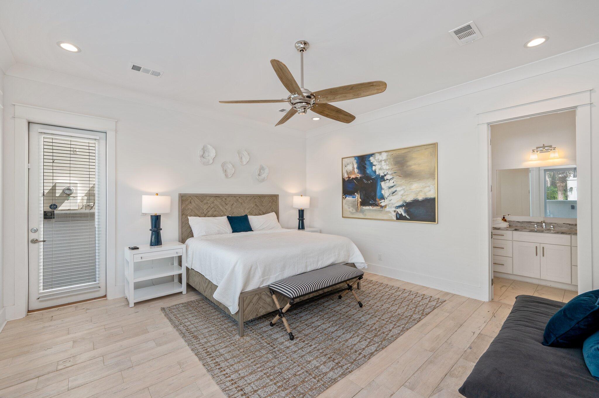 4795 Ocean Boulevard Destin, FL 32541 - Photo 6 of 50 a spacious bedroom with a bed and a chandelier
