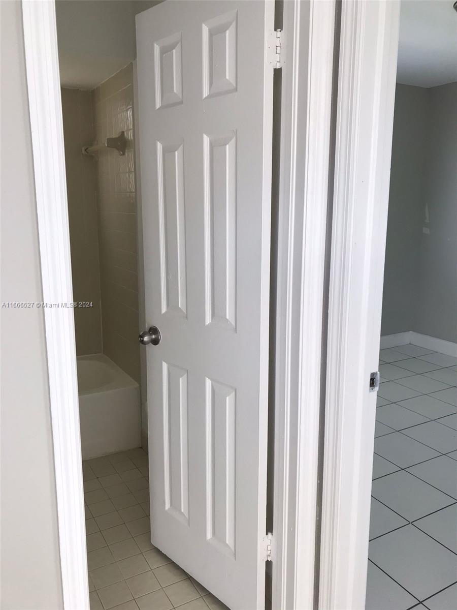 459 Northeast 210th Cir Terrace, Unit 20117 Miami, FL 33179 - Photo 11 of 33 a view of a hallway